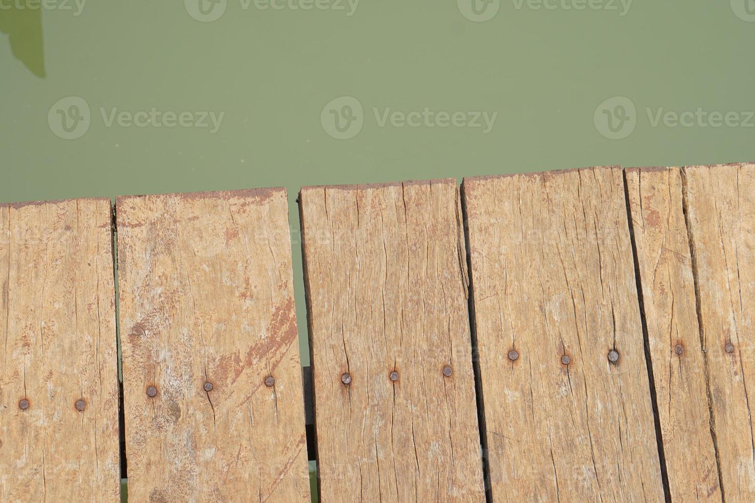 wooden floor walkway in pond photo