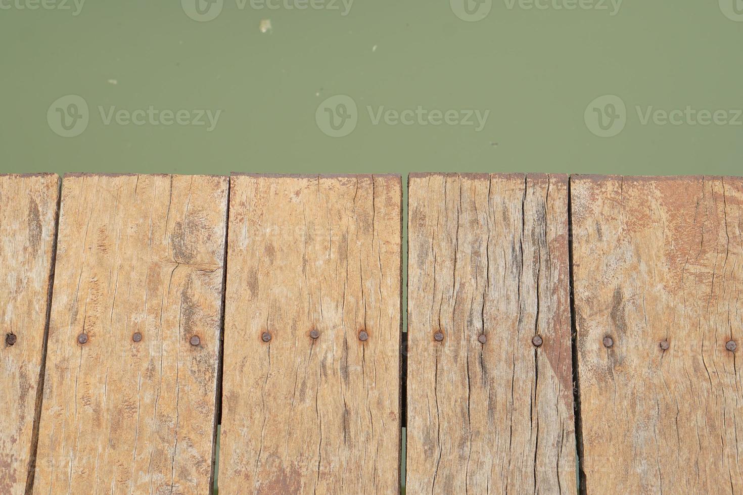 wooden floor walkway in pond photo