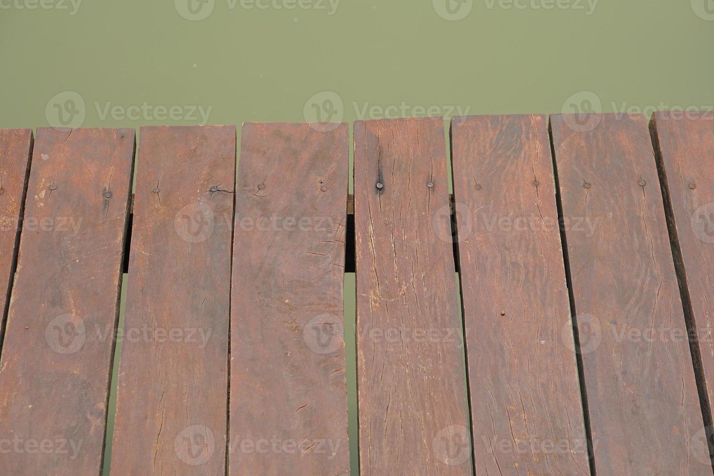 wooden floor walkway in pond photo
