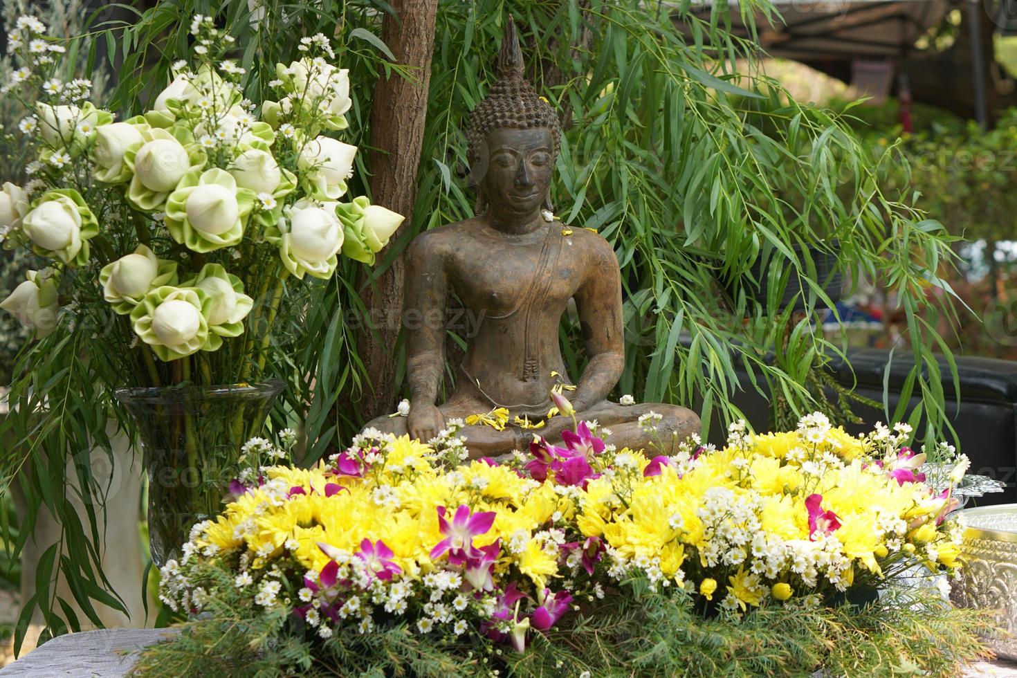 Buddha images for pouring blessings on the Songkran day photo