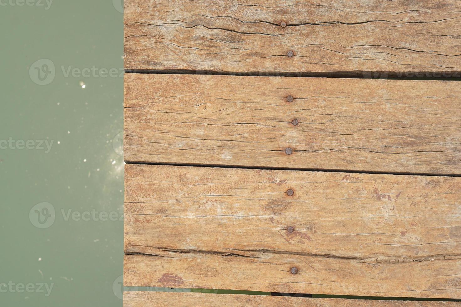 wooden floor walkway in pond photo