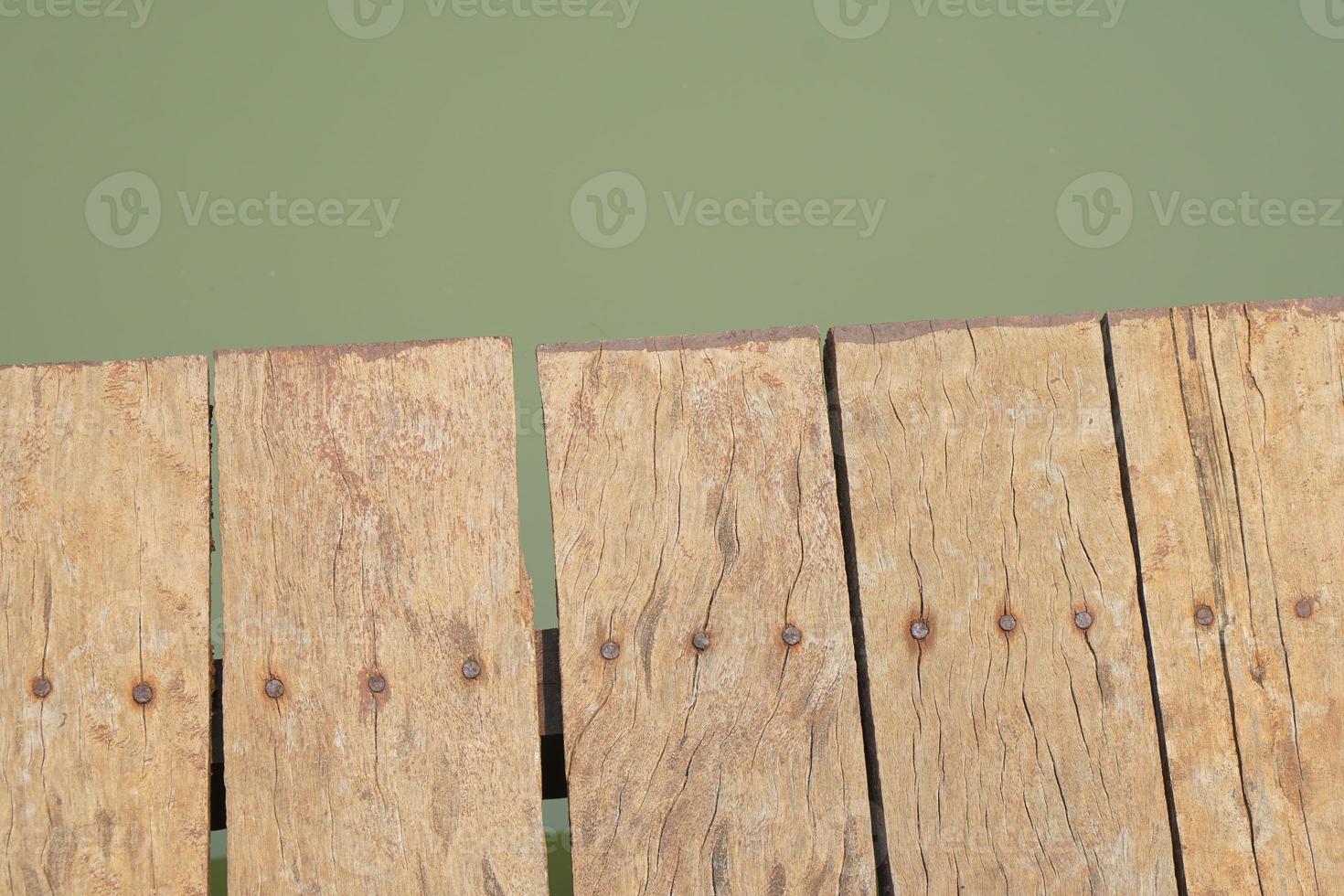 wooden floor walkway in pond photo