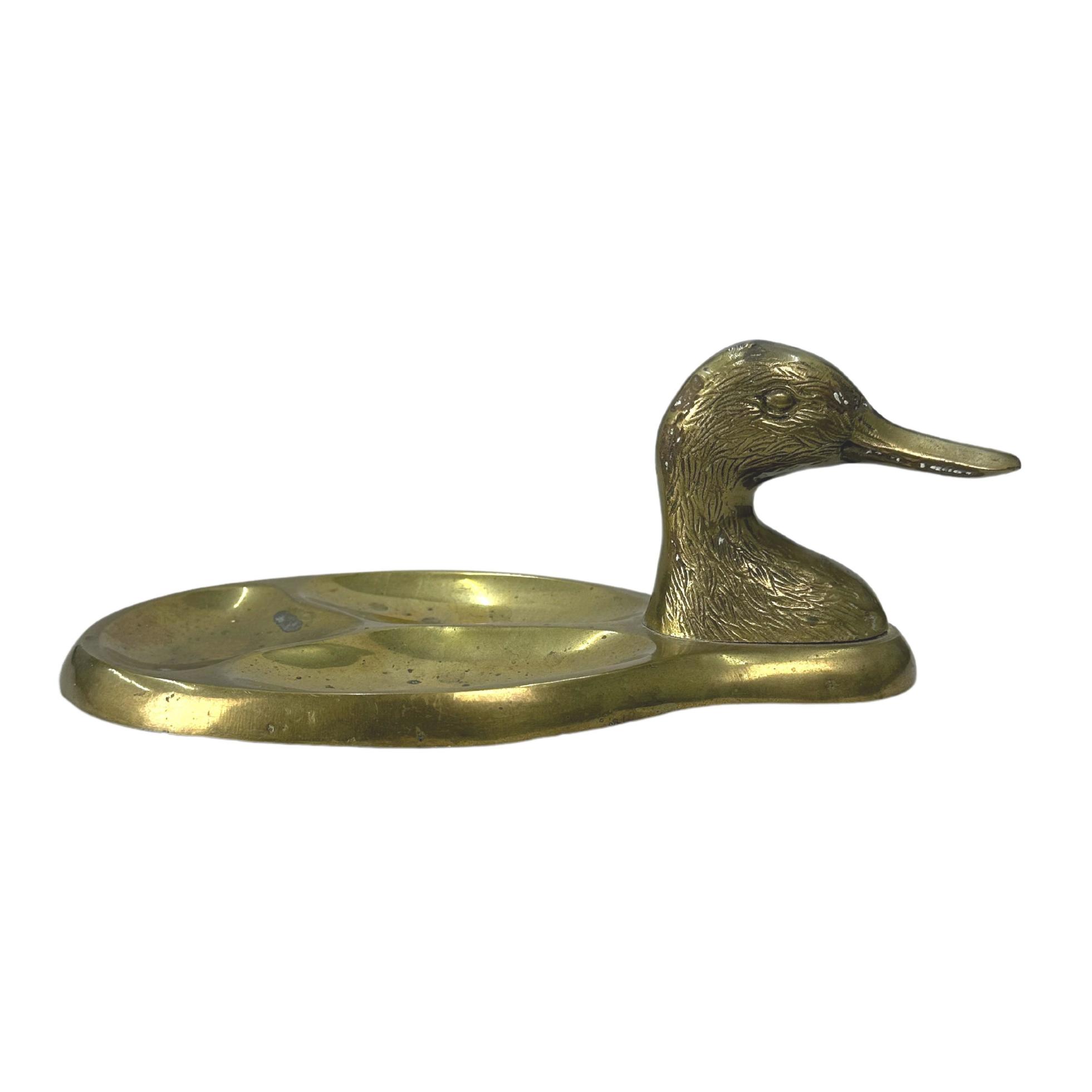 Vintage Brass Duck Head Trinket Tray 22697666 Stock Photo at Vecteezy