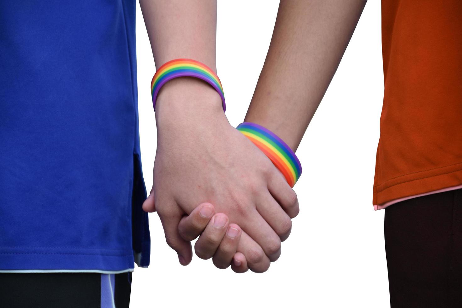 Isolated hands which wear rainbow wristband around them with clipping paths. photo