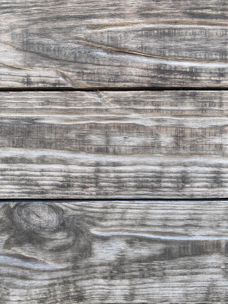 old gray wooden wall made of planks photo