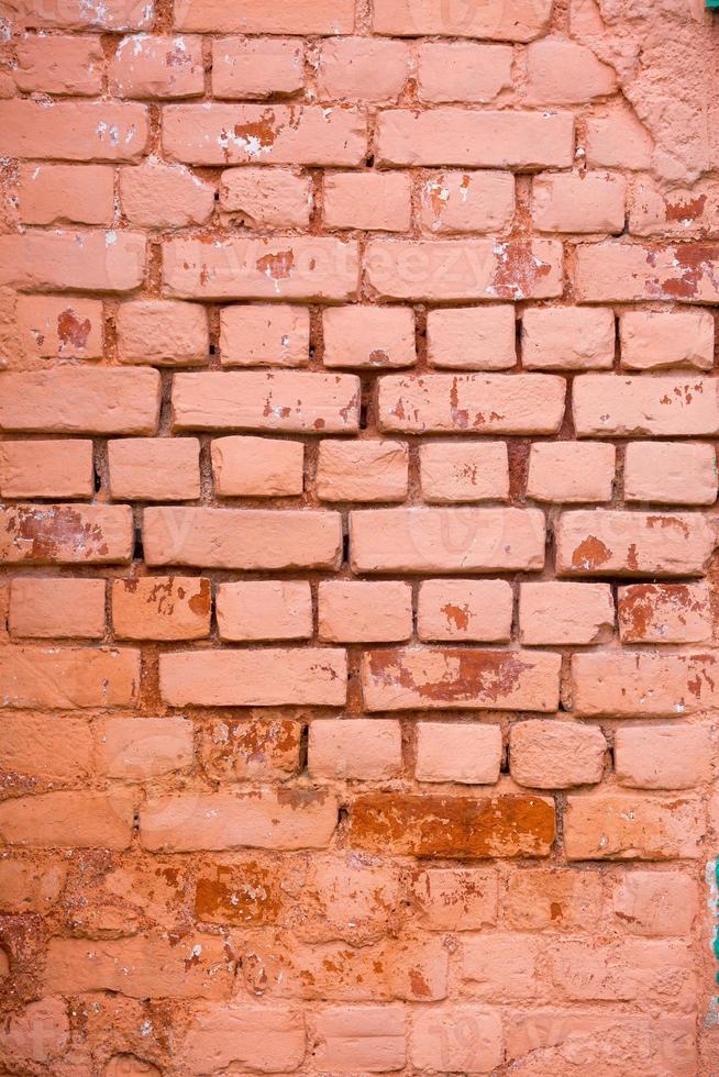 Red, Orange, yellow and blue color combination old Textured damage wall with Colorful Bricks. photo