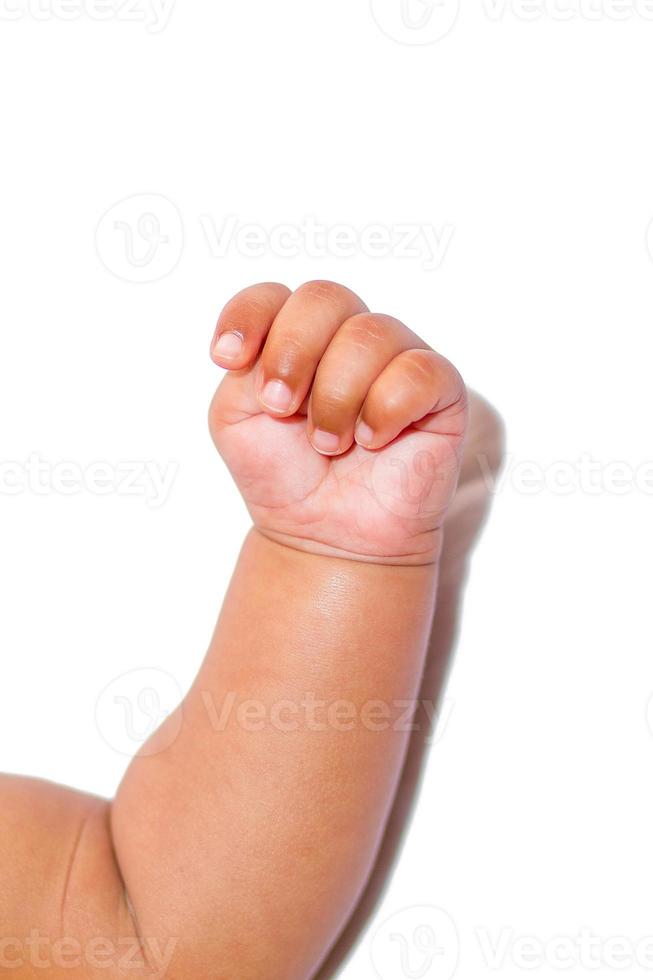 A asian new born babys Clenched hand on a white background. photo