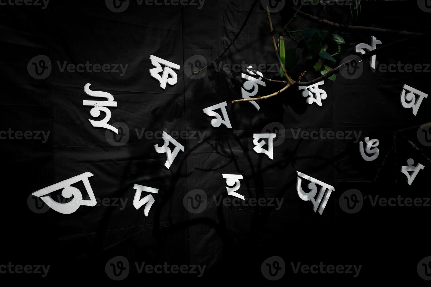 The white letters of the Bengali alphabet are Being visible in the black background. 21st February is the International Mother Language Day of Bangladesh. photo