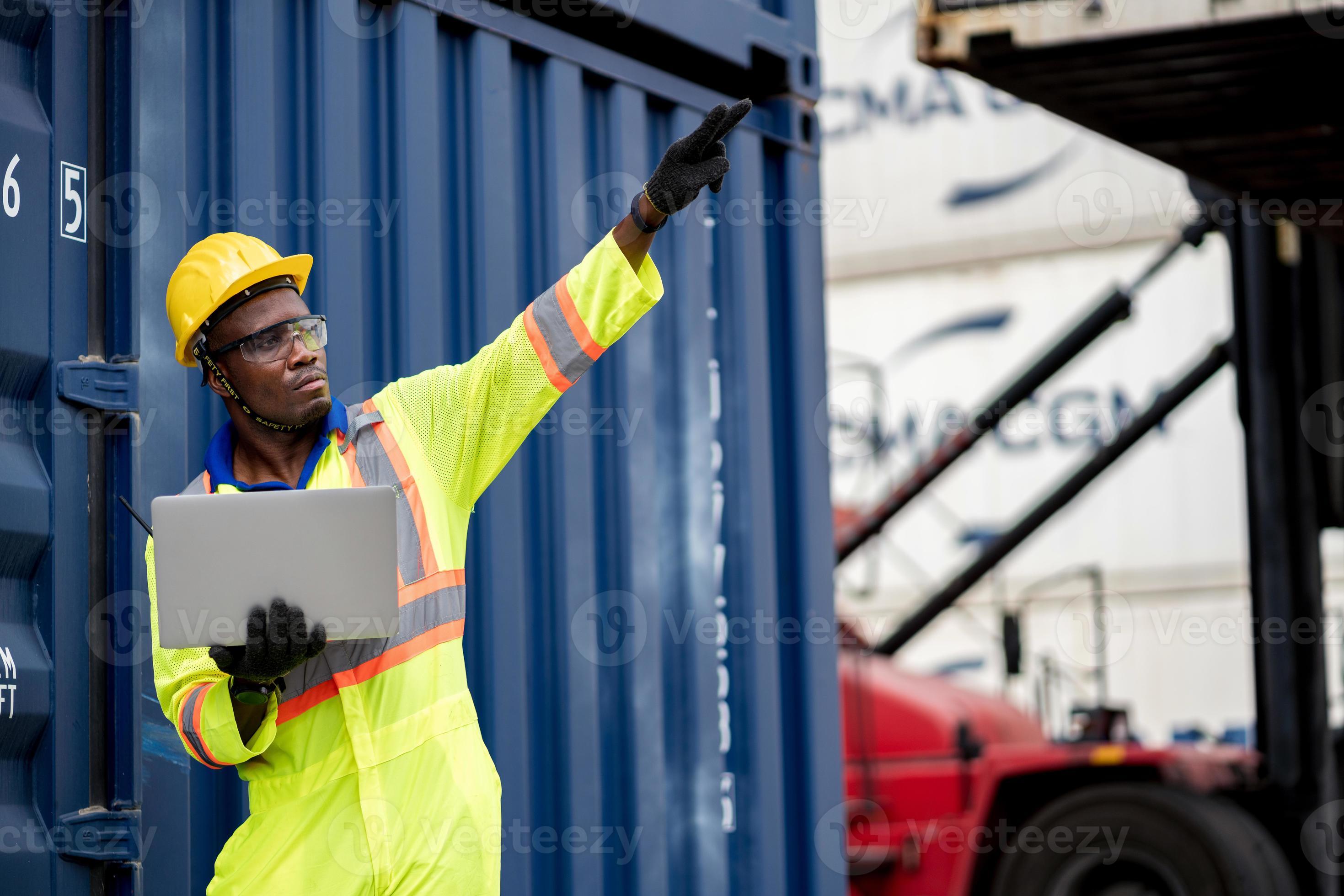 African technician dock worker in protective safety jumpsuit uniform
