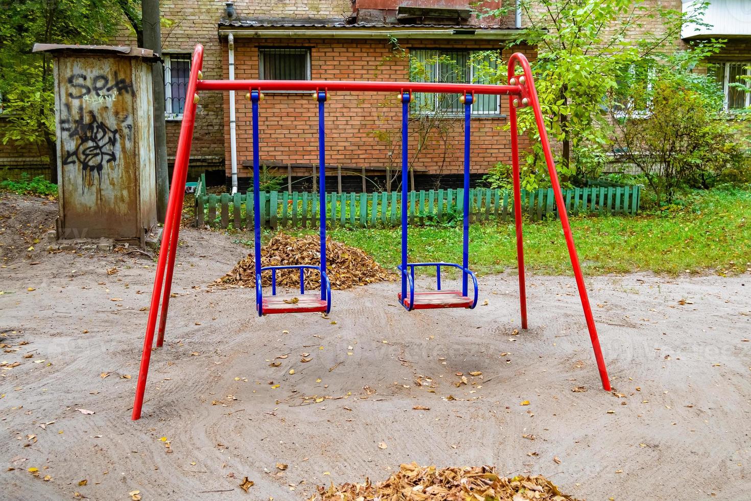 Photography on theme empty playground with metal swing for kids photo