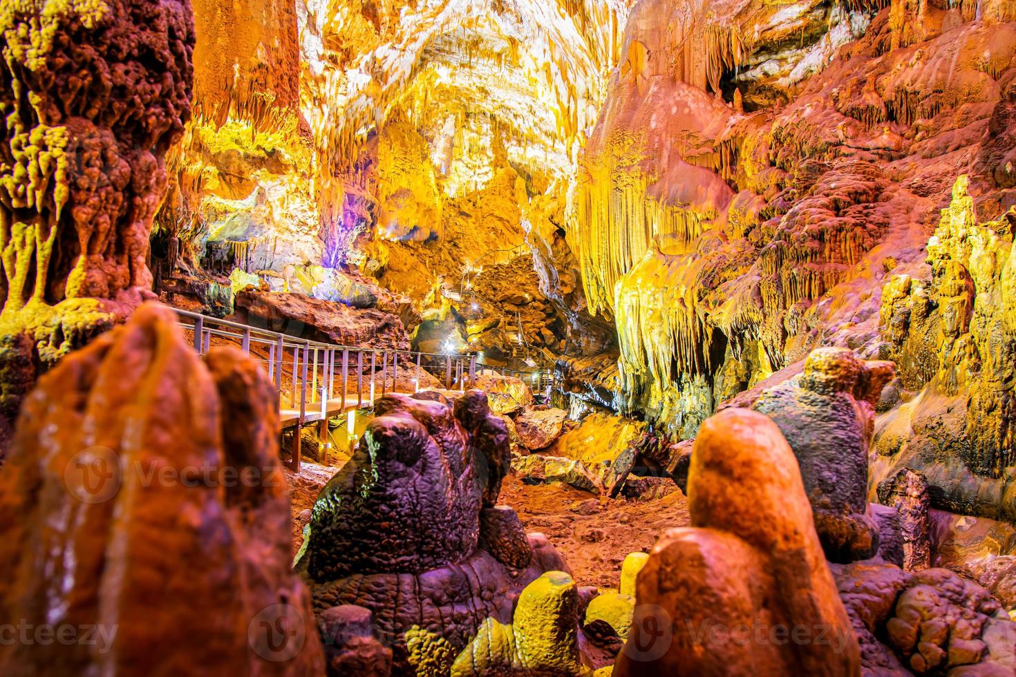 Beautiful Prometheus cave with no tourists and illuminated geological million years formations photo