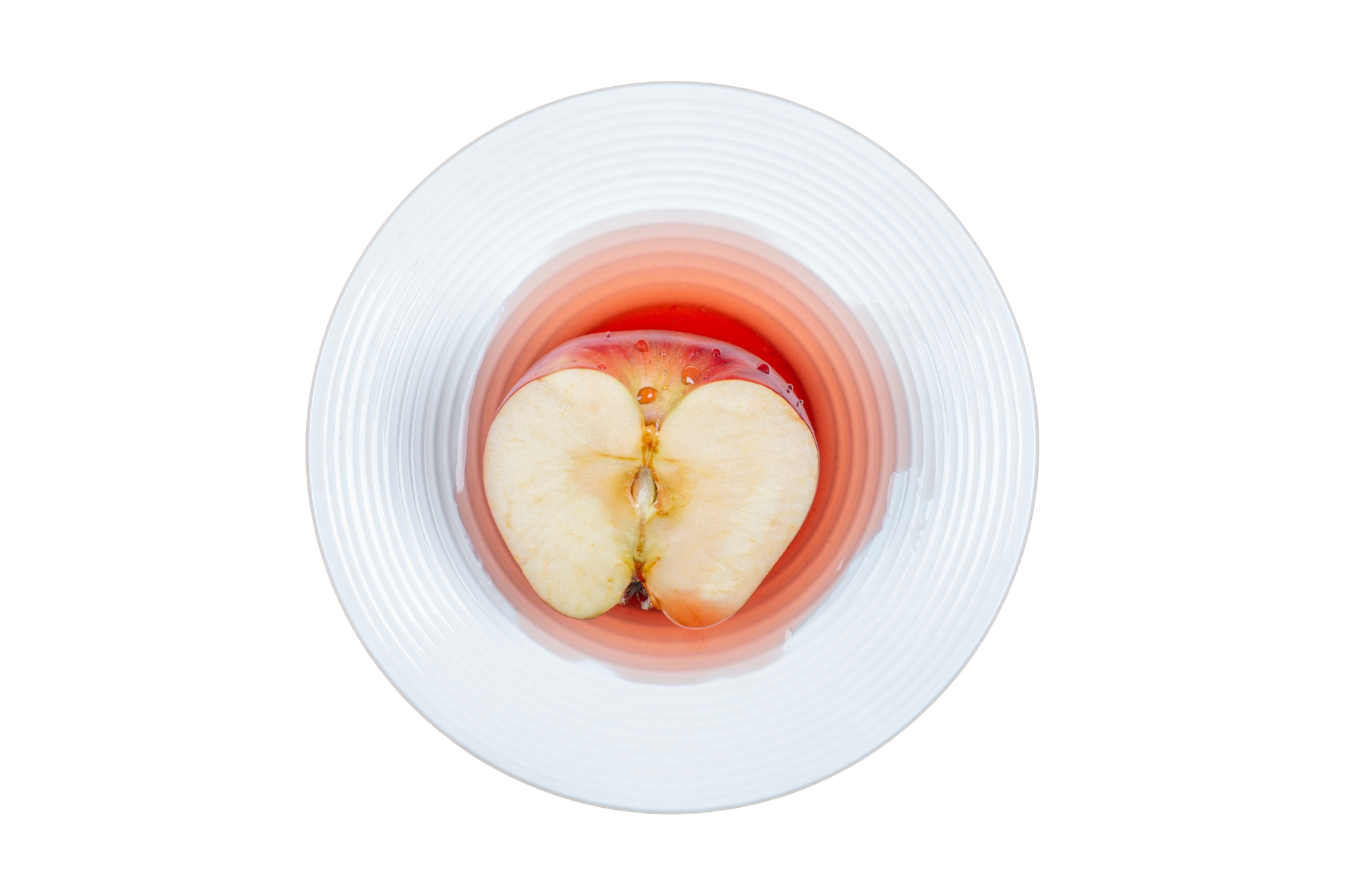 White plate with half red apple isolated on a transparent background