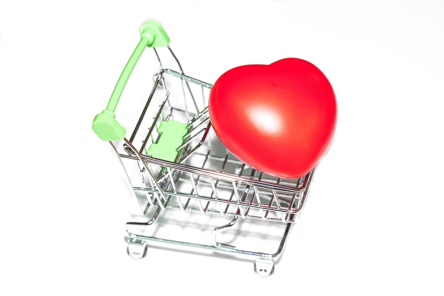 red heart ball in shopping cart photo