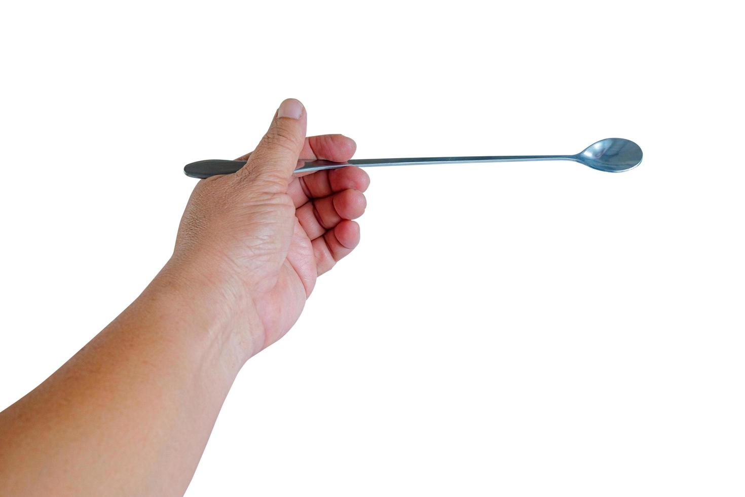 Hand holding a long tail spoon on white background. photo