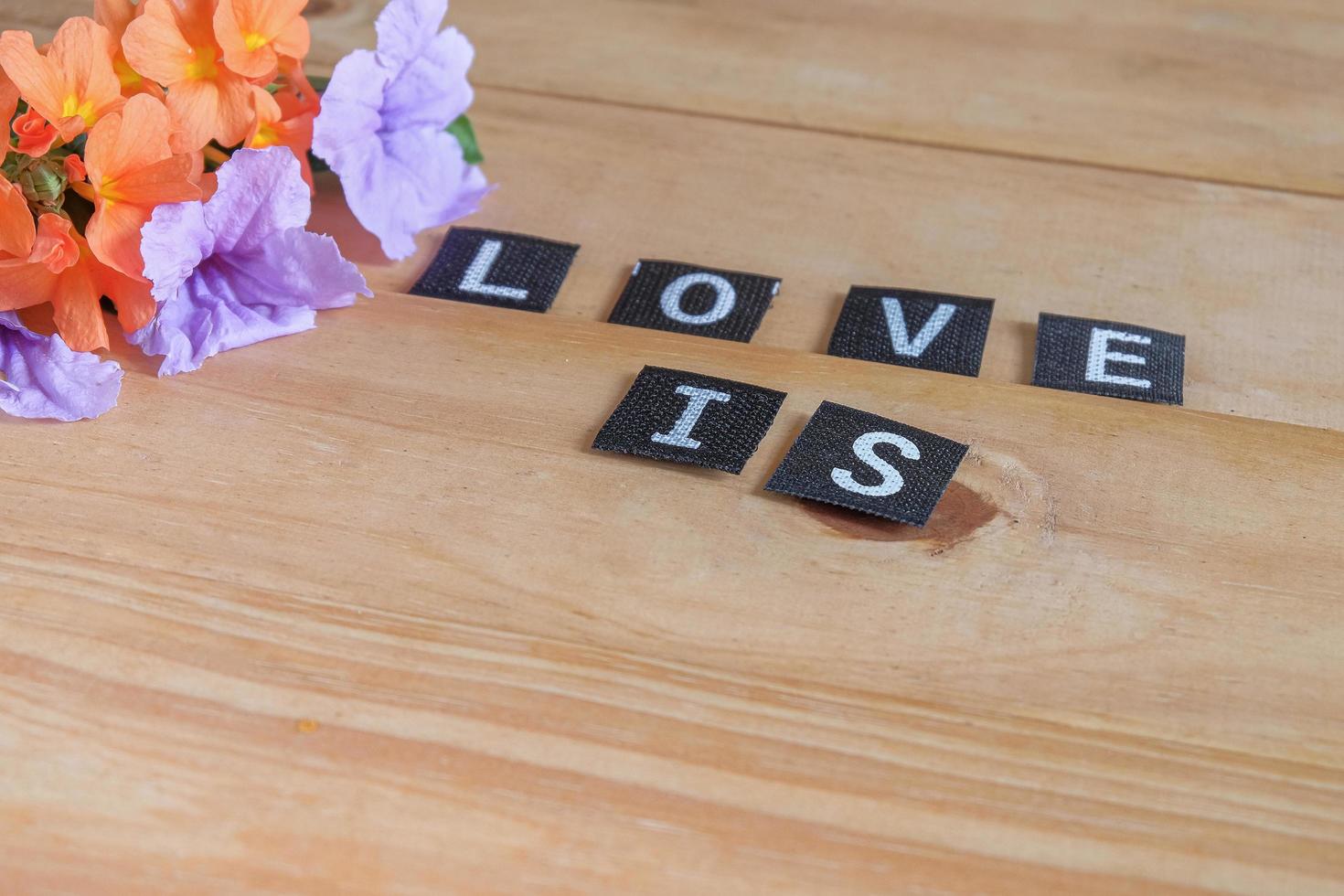 Text word Love is on wood table , love concept. photo