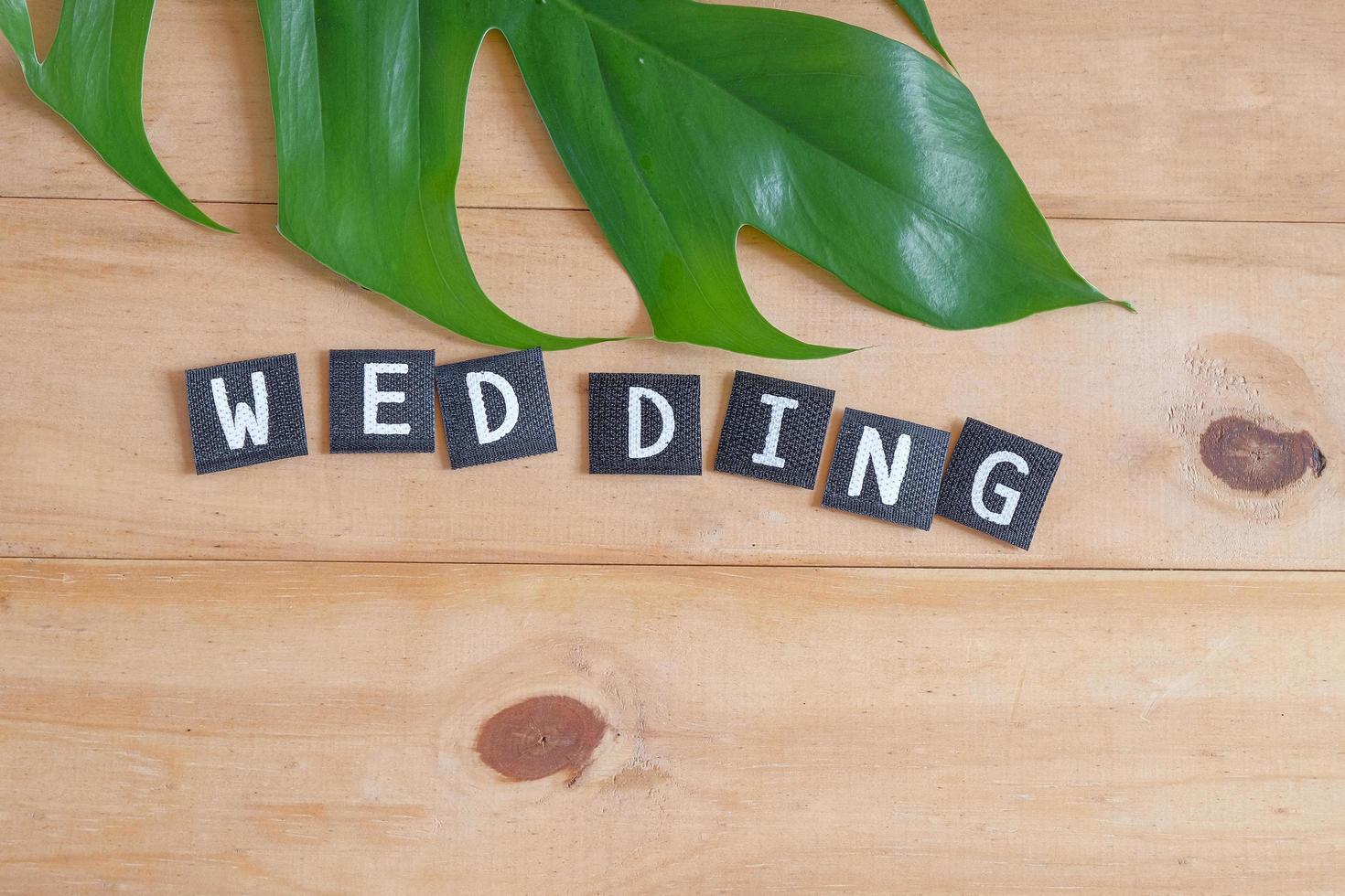 Wedding text on wood table , love concept. photo