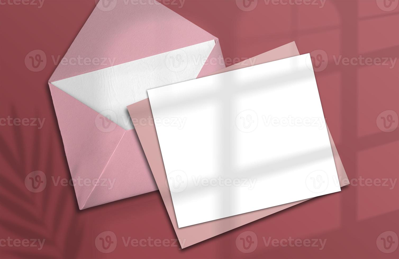 Logo paper template. A square paper mockup in realistic shades with an envelope on a pink background. Tropical shade plants. Template, flyer, poster, blank ad, special invitation photo