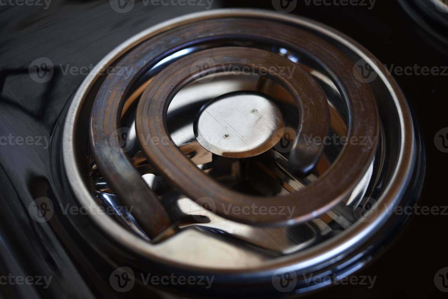Electric tile in the kitchen. The spiral of the electric stove. photo