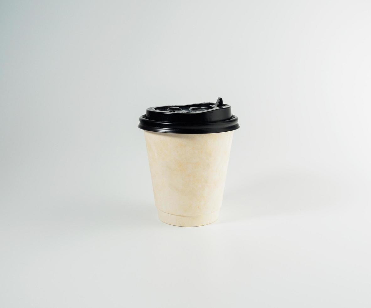 Front top view, white coffee paper cup black lid, filled with hot black coffee americano, no sugar milk, ready to drink, refreshing. aroma awake fresh to work placed on a white isolated background photo