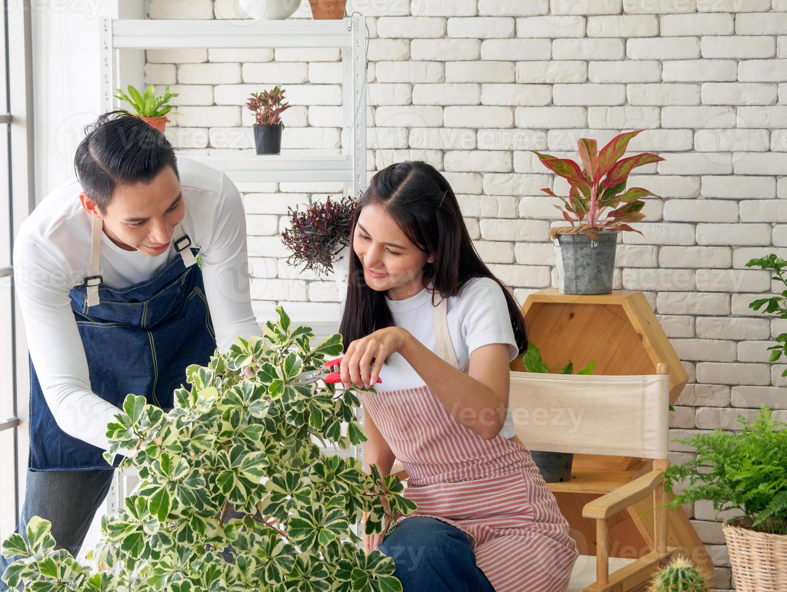 Gardener young Asian man woman two person sit floor and smiling ...