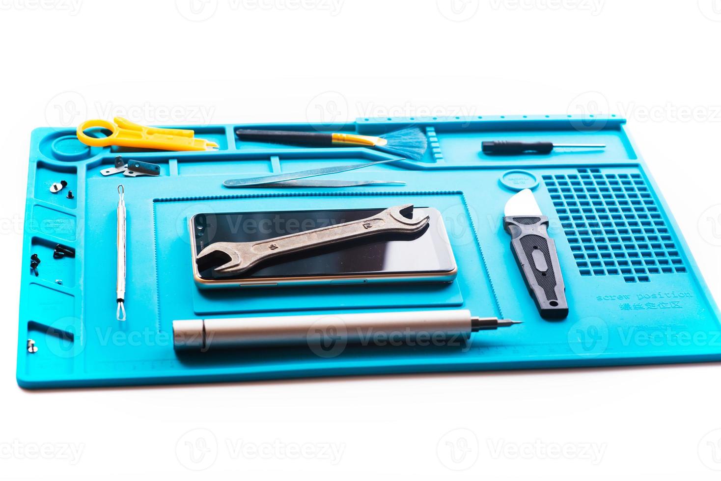 Flat lay image of dismantling the broken smart phone for preparing to repair or replace some components, Top view photo