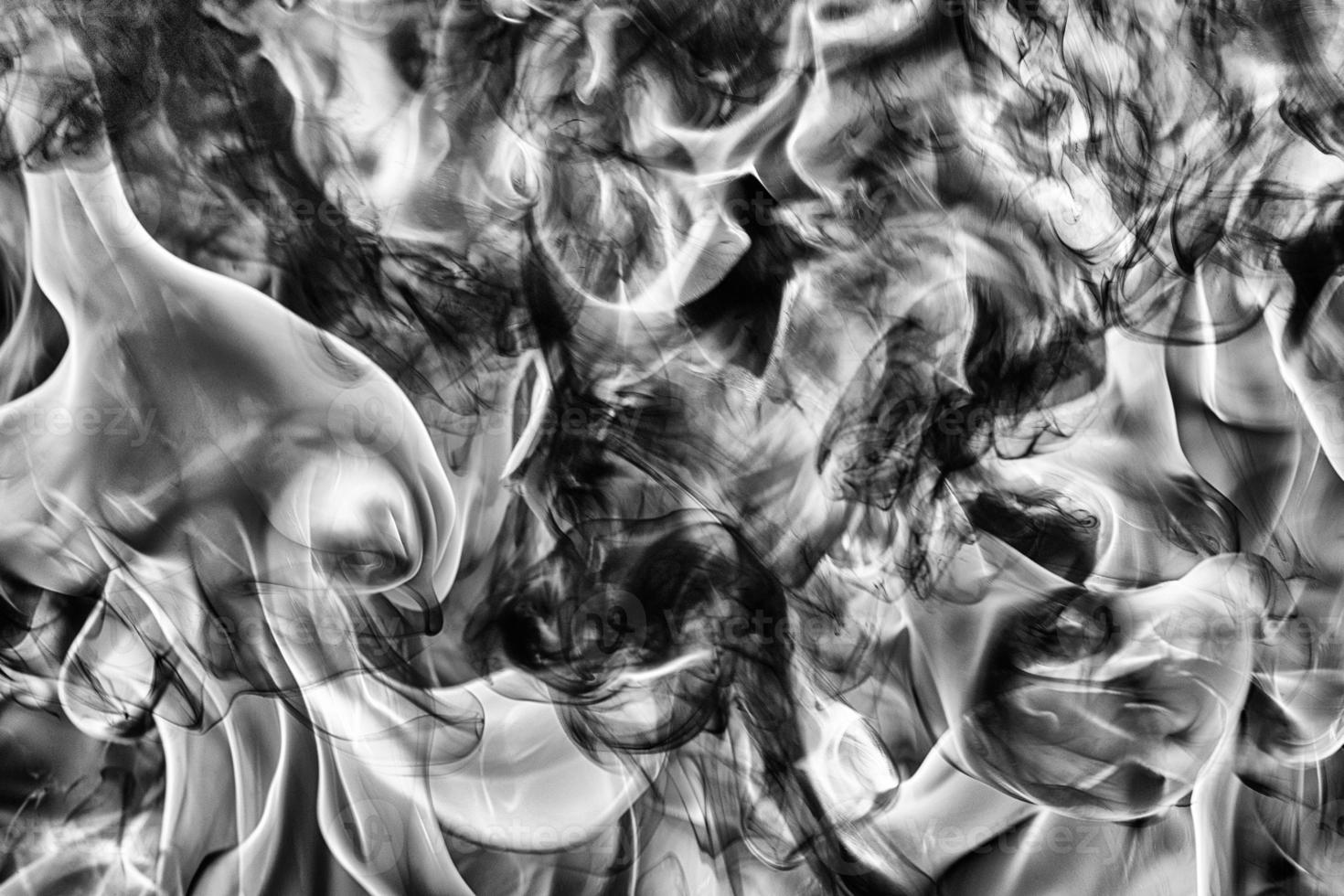 Abstract black smoke black smoke and white huge flame of strong fire. Dangerous abstract texture photo