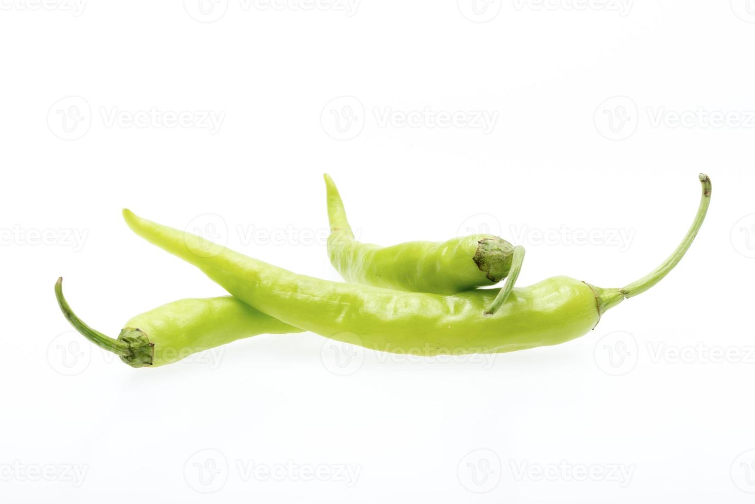 Green chili pepper isolated on white photo