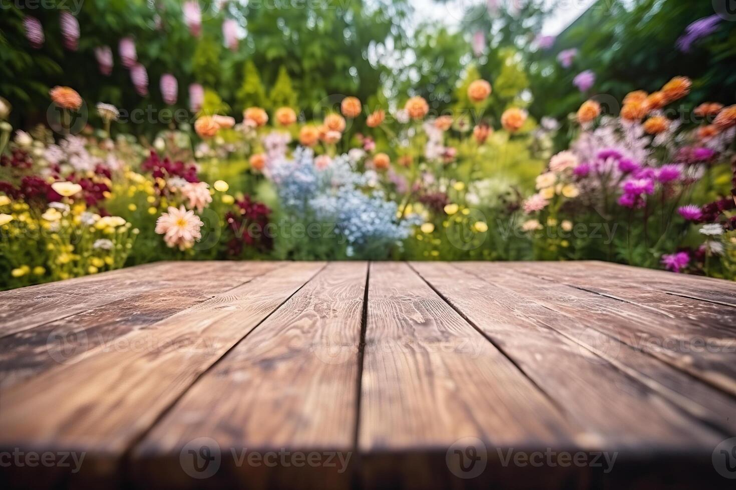Empty wooden table in flowers garden blurred background, Free space for product display. photo