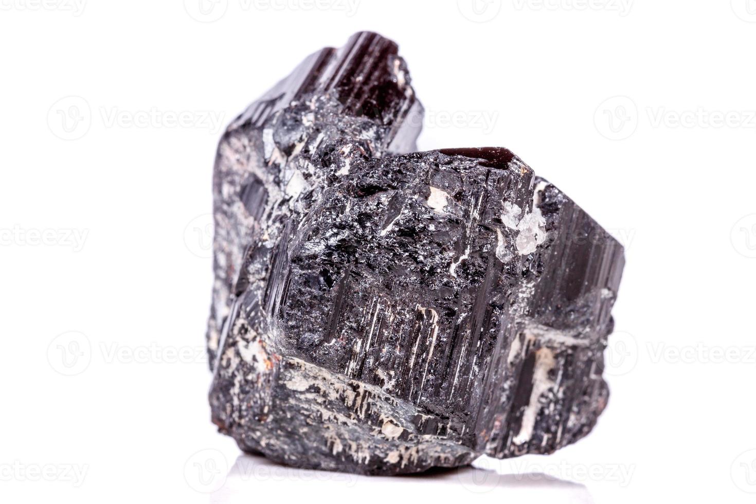 macro mineral stone sherle, schorl, black tourmaline on white background photo