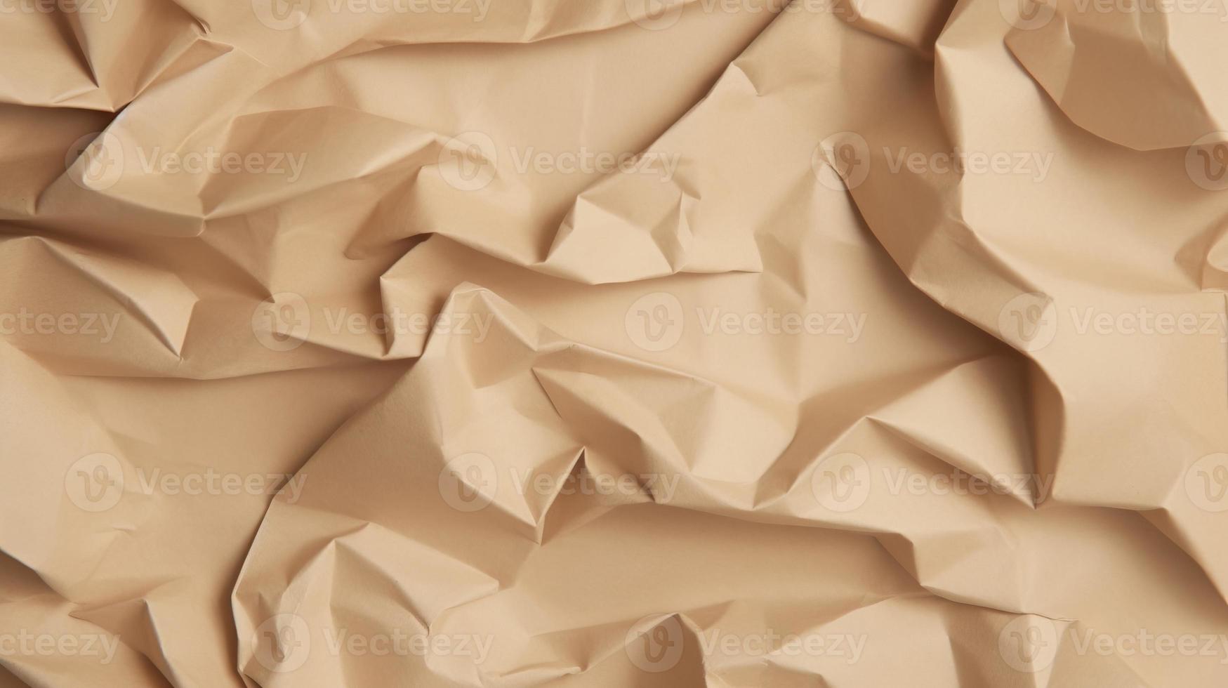 close up of crumpled brown paper texture background with copy space photo