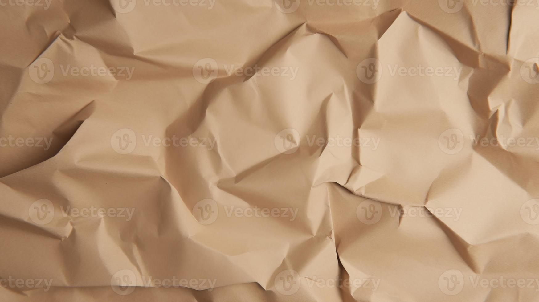 close up of crumpled brown paper texture background with copy space photo
