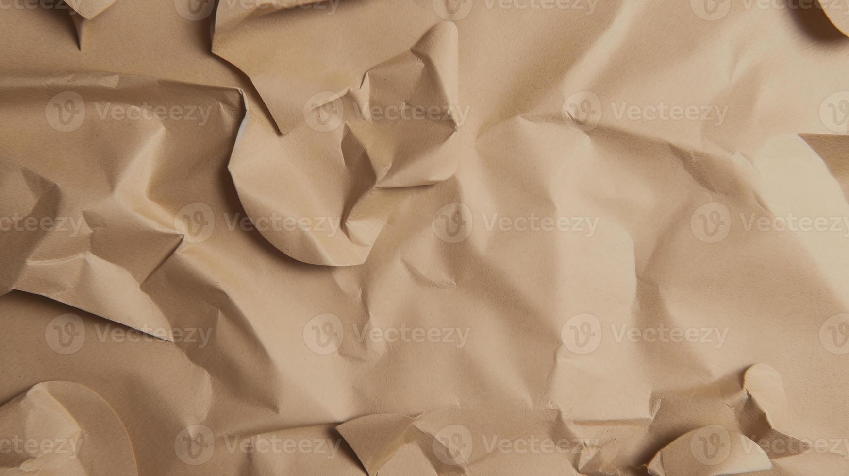 close up of crumpled brown paper texture background with copy space photo