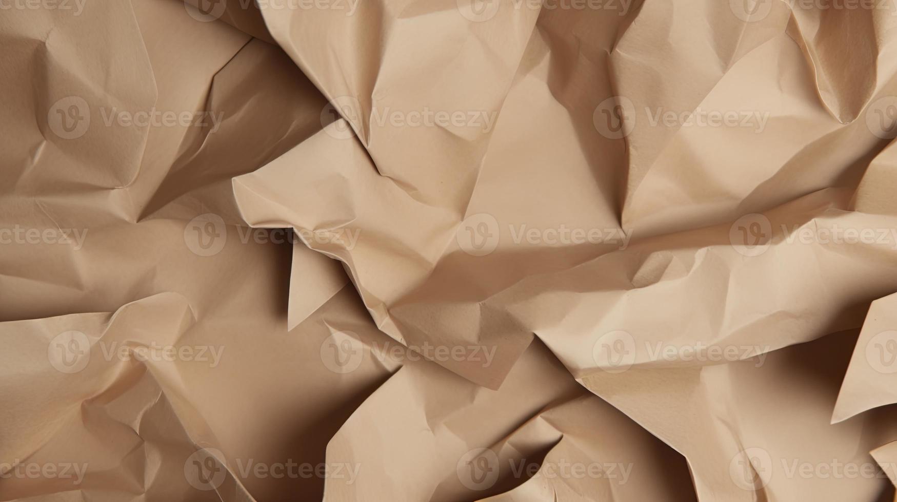 close up of crumpled brown paper texture background with copy space photo