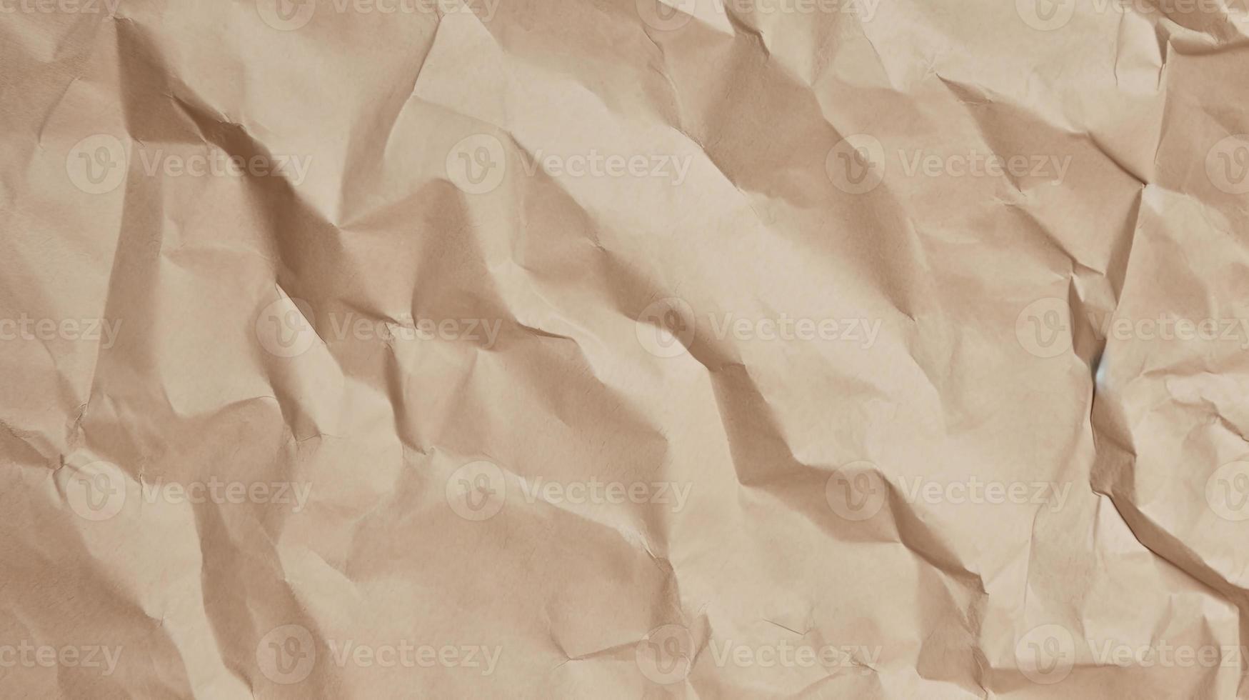 close up of crumpled brown paper texture background with copy space photo