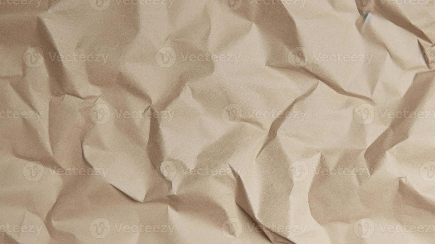 close up of crumpled brown paper texture background with copy space photo
