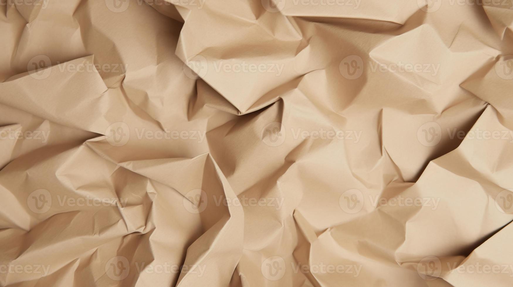 close up of crumpled brown paper texture background with copy space photo