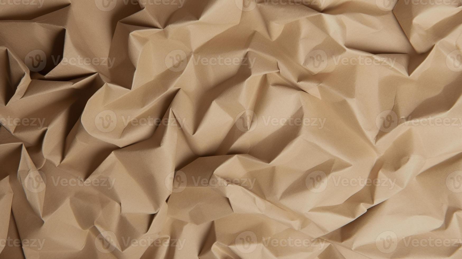 close up of crumpled brown paper texture background with copy space photo