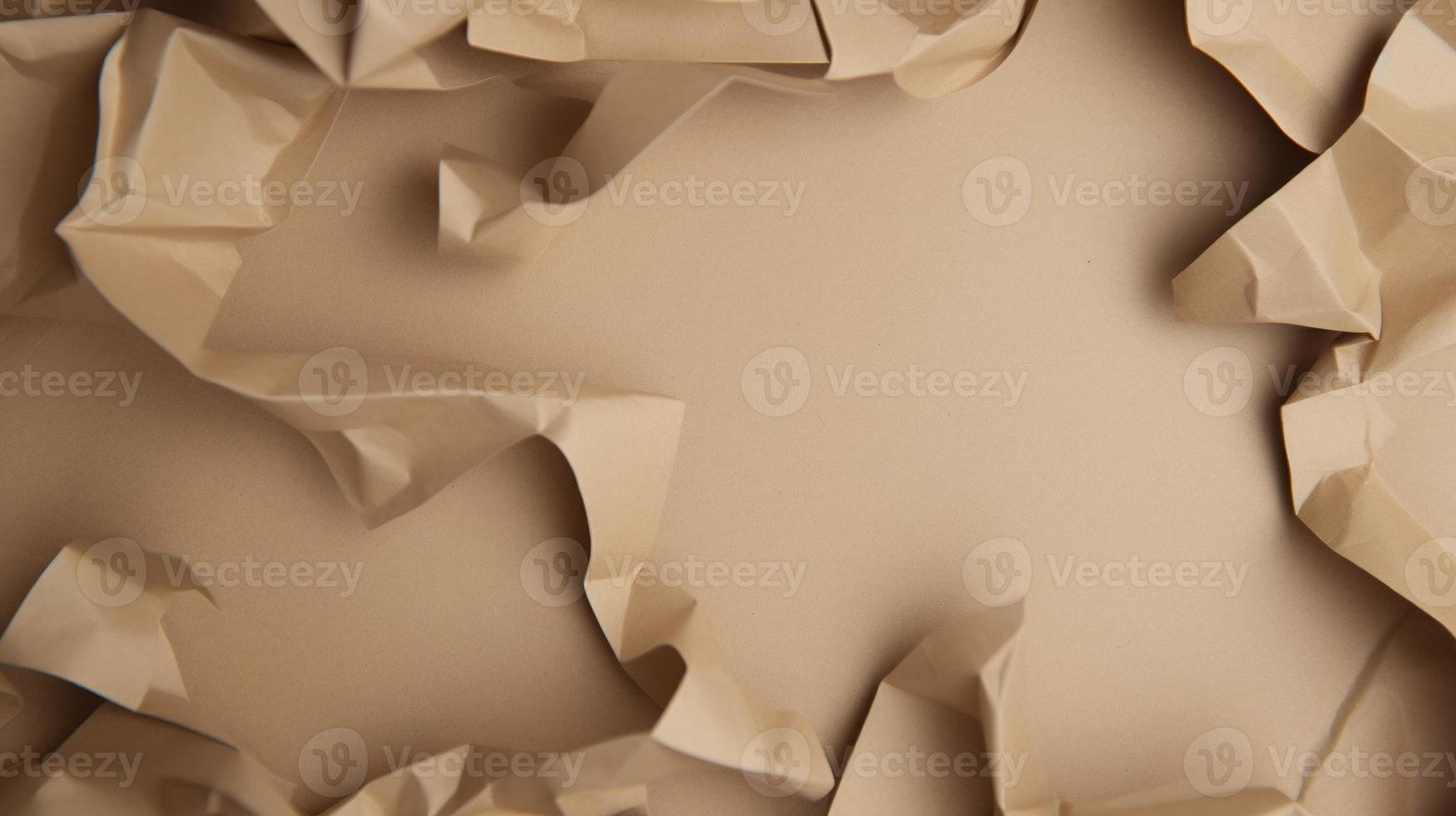 close up of crumpled brown paper texture background with copy space photo