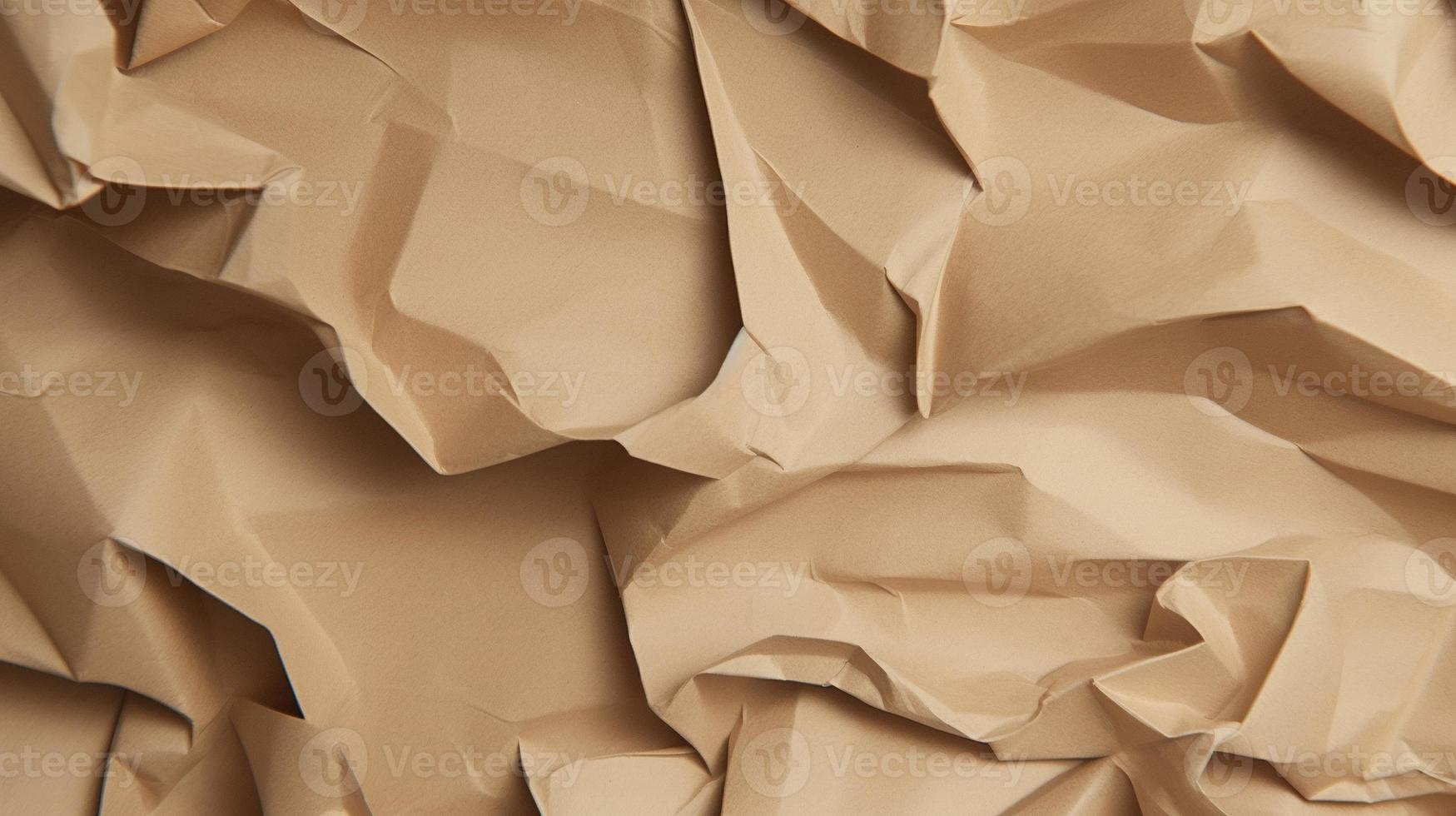 close up of crumpled brown paper texture background with copy space photo