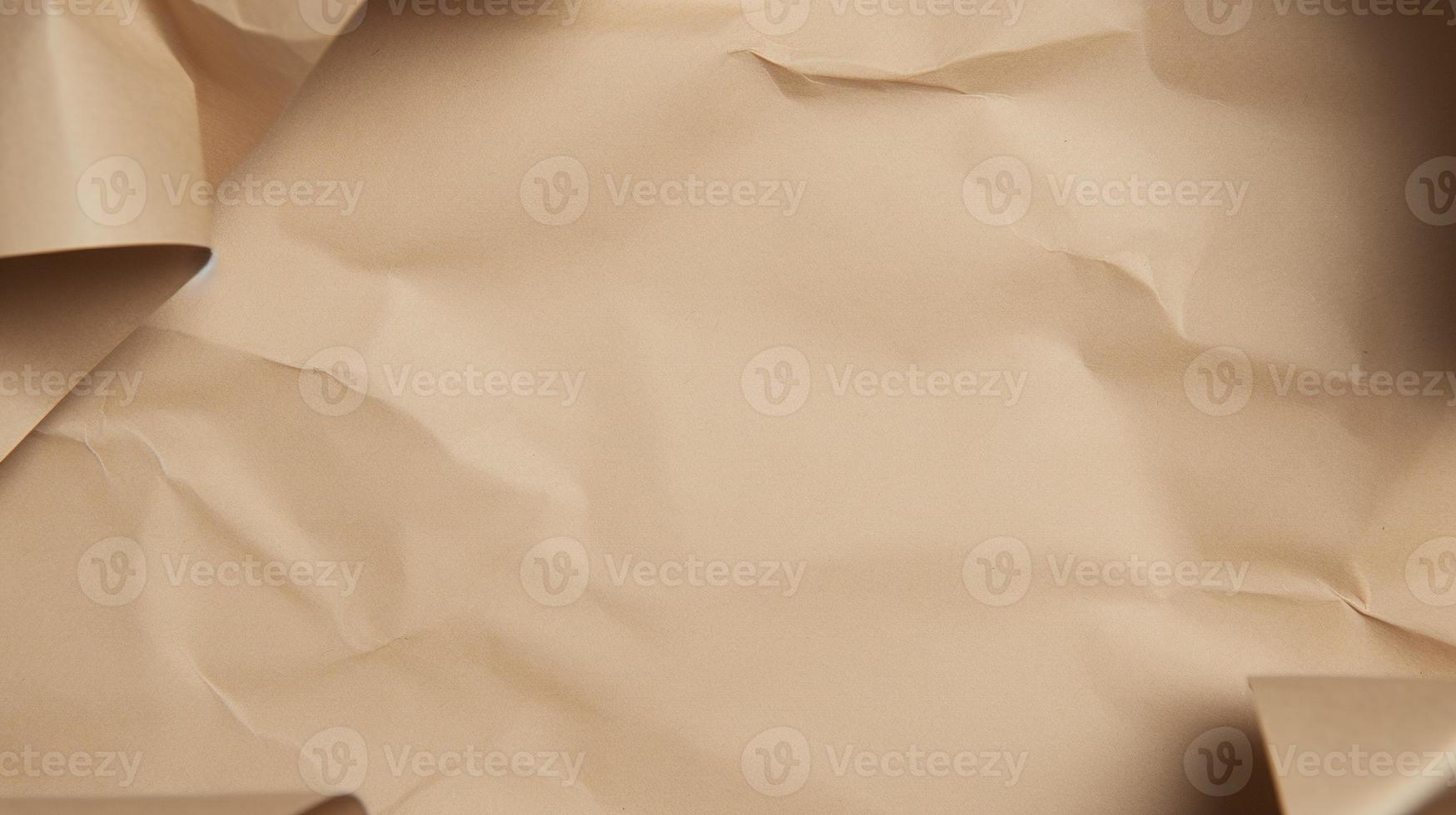 close up of crumpled brown paper texture background with copy space photo