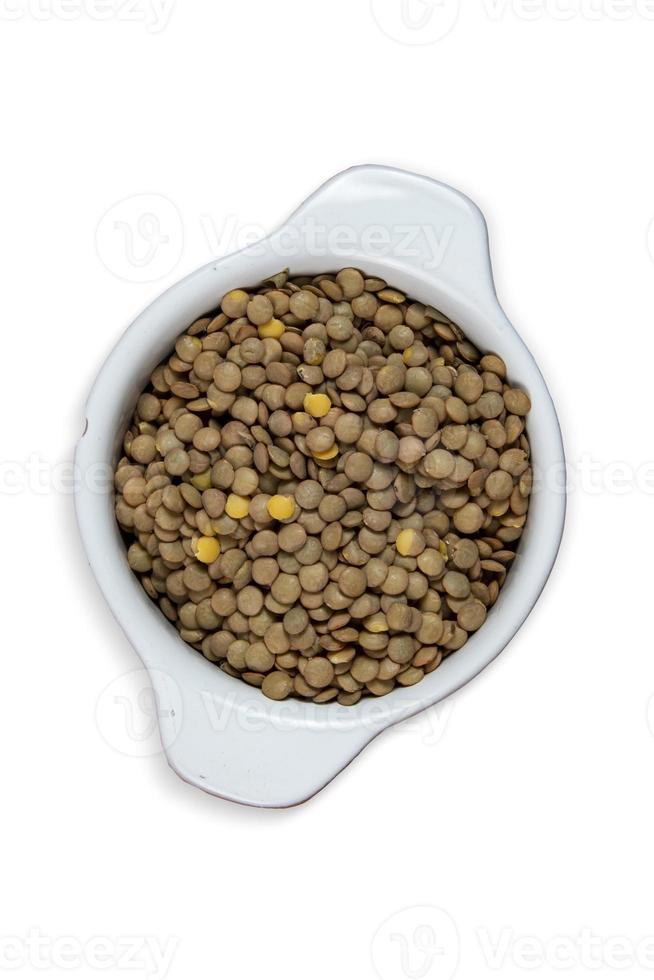 Lentils in bowl isolated with background. Top view. Flat lay. photo