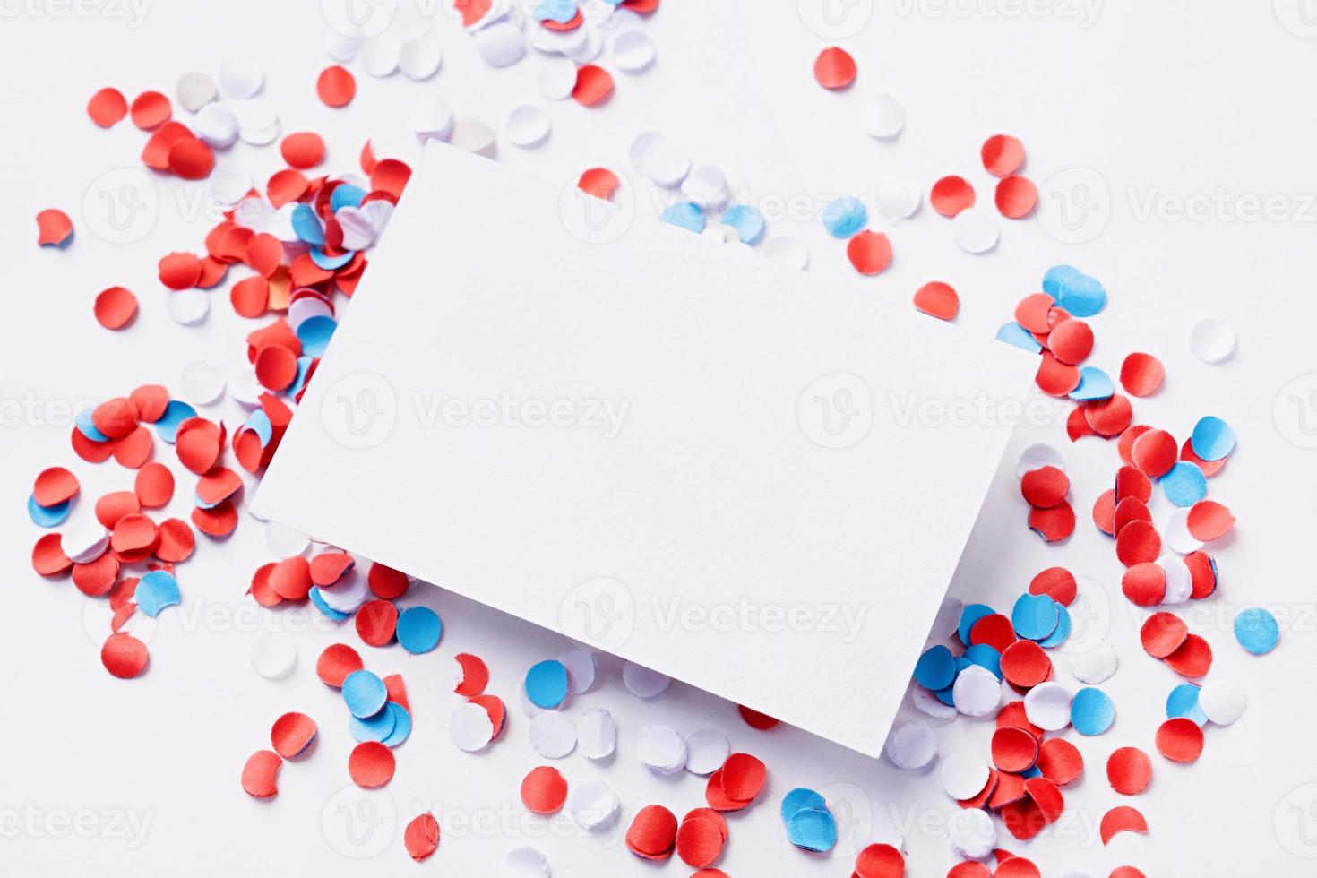 business card mockup on colorful circle confetti, decorations for fourth july photo