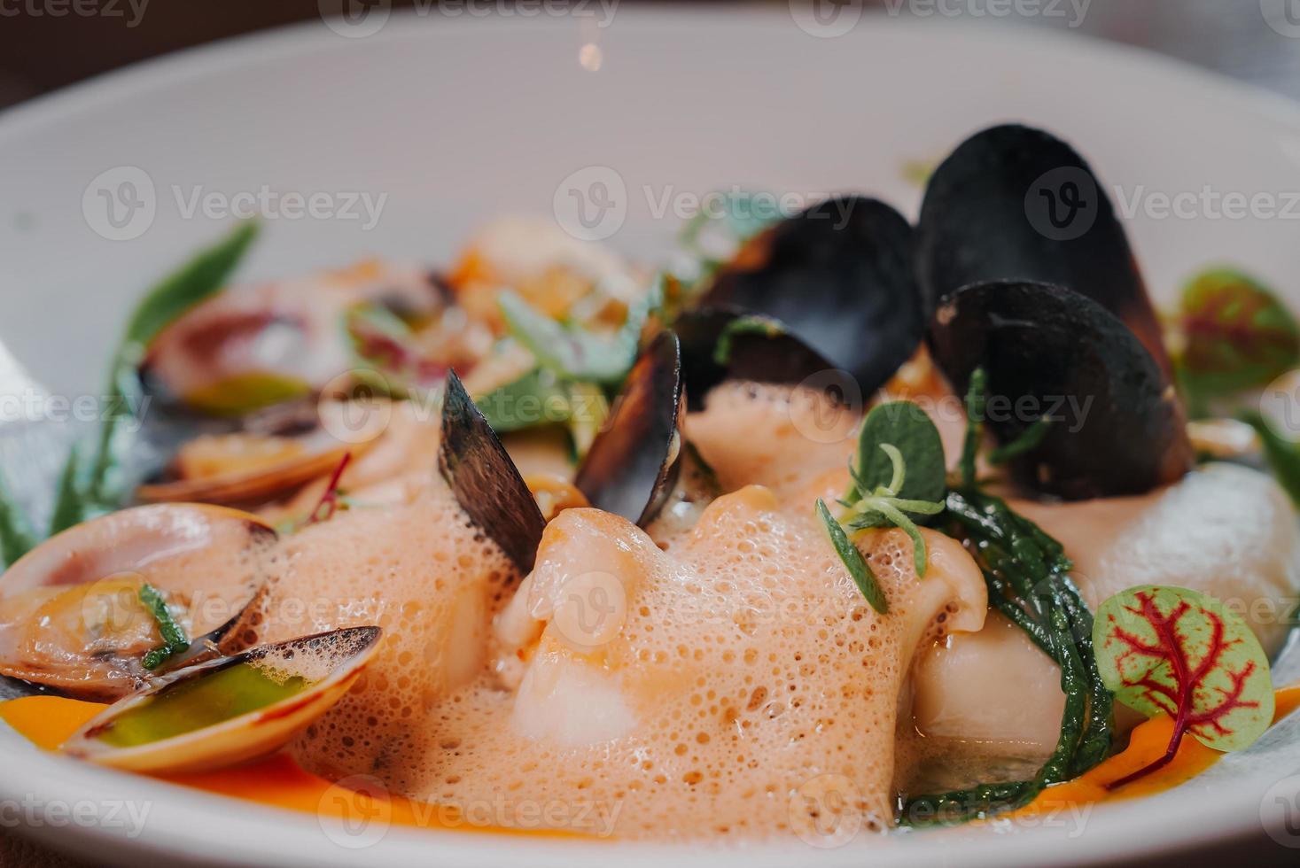 Close up view of the grilled scallop on a plate photo