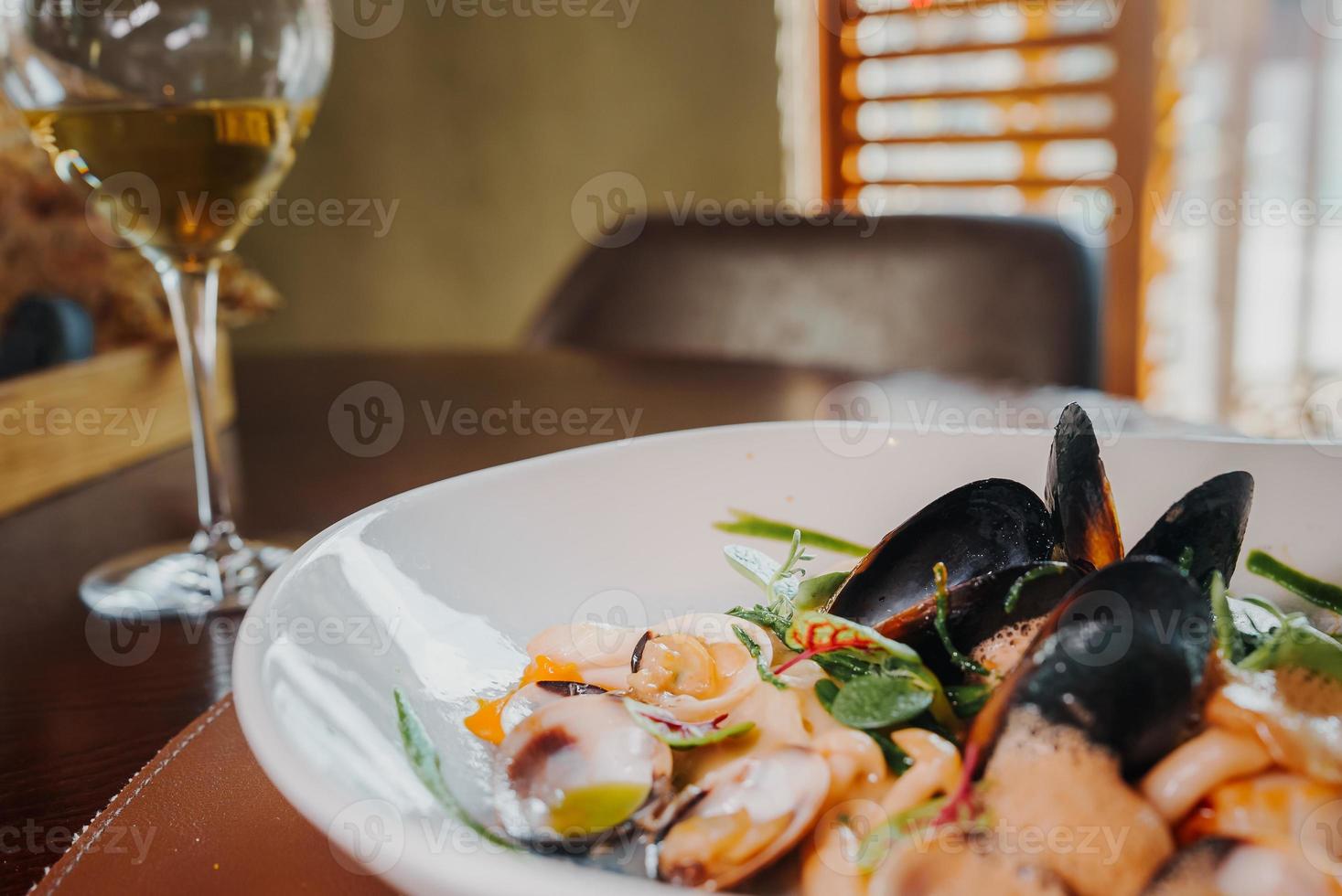 Close up view of the grilled scallop on a plate photo