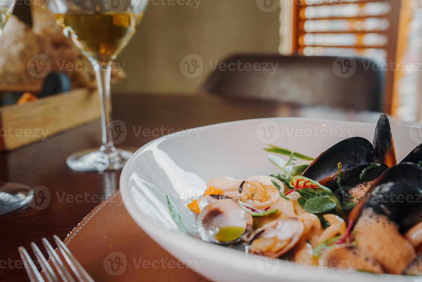 Close up view of the grilled scallop on a plate photo