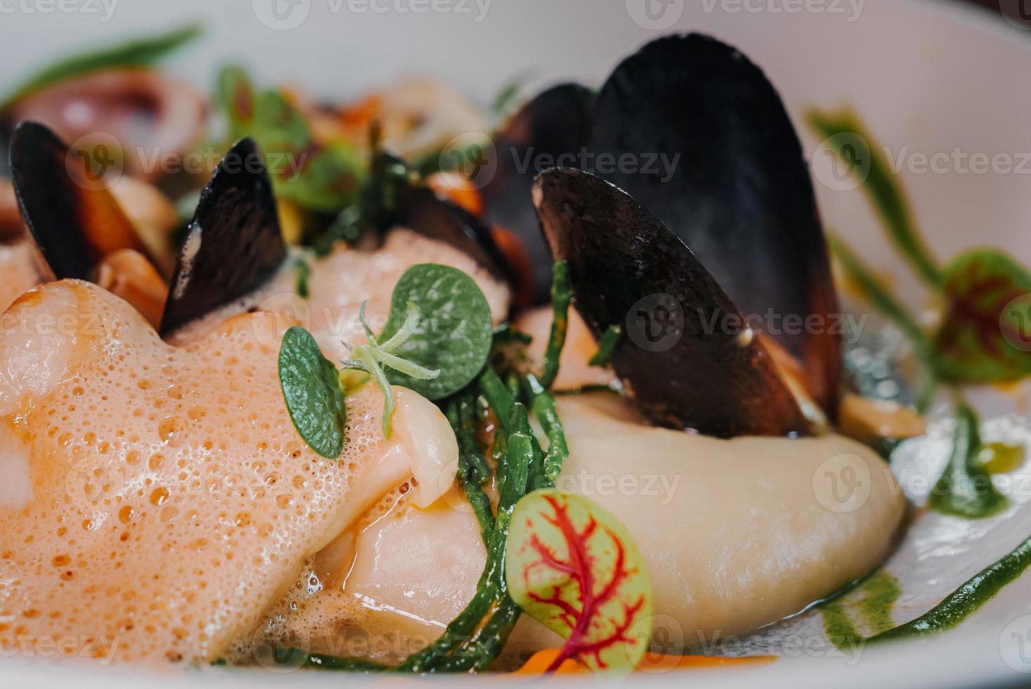 Close up view of the grilled scallop on a plate photo