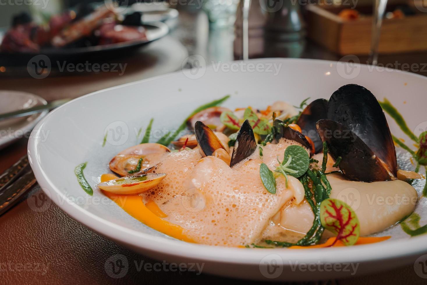 Close up view of the grilled scallop on a plate photo