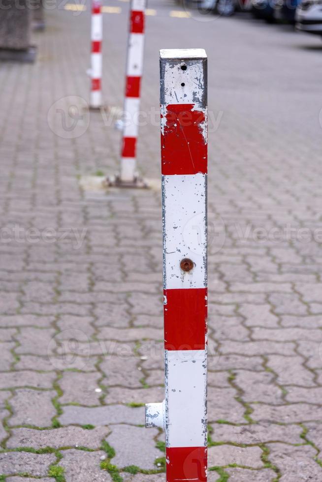 metal poles for barrier on a road photo