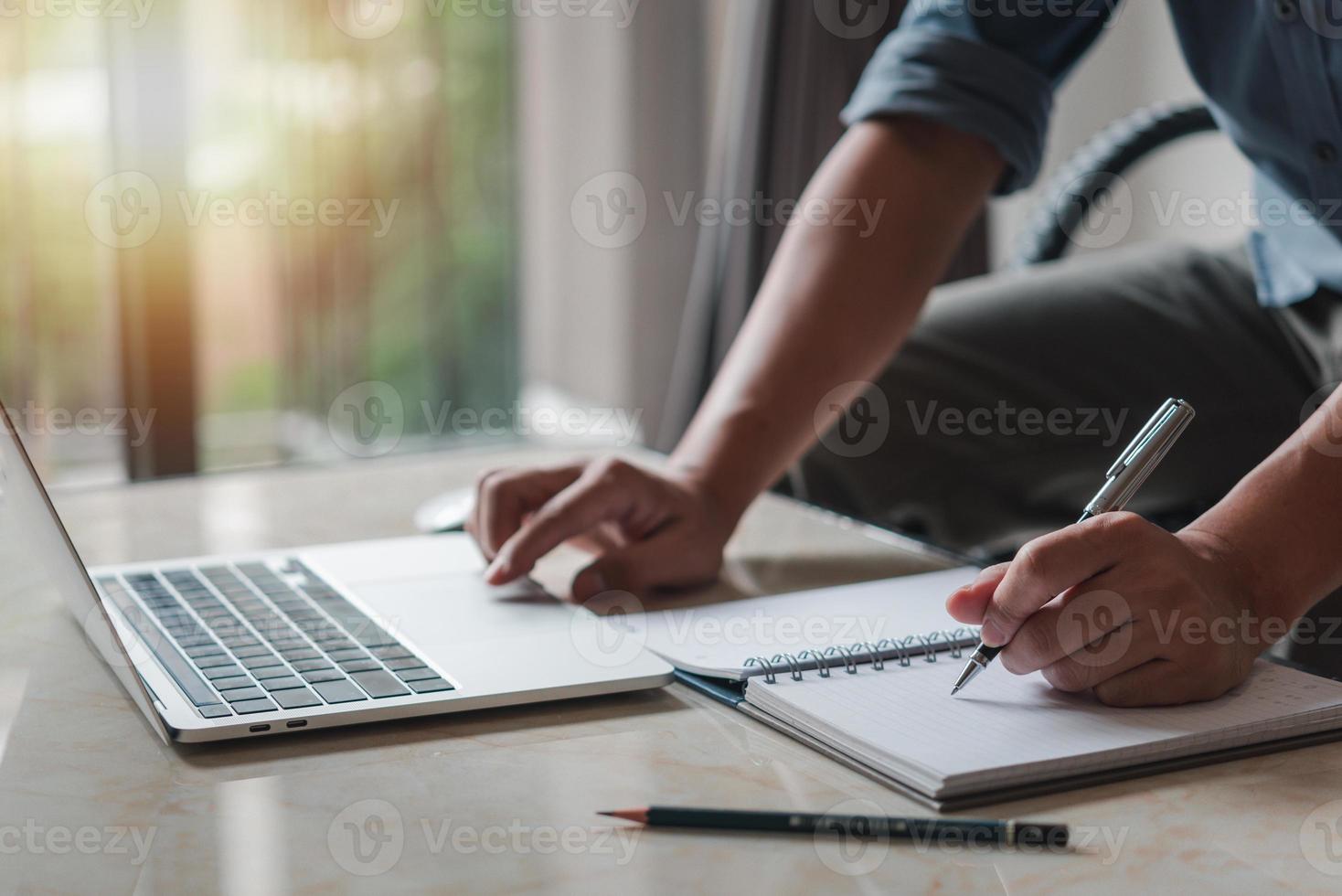 Businessperson reading and writing on book.education studying knowledge development and cognition learning concept. photo