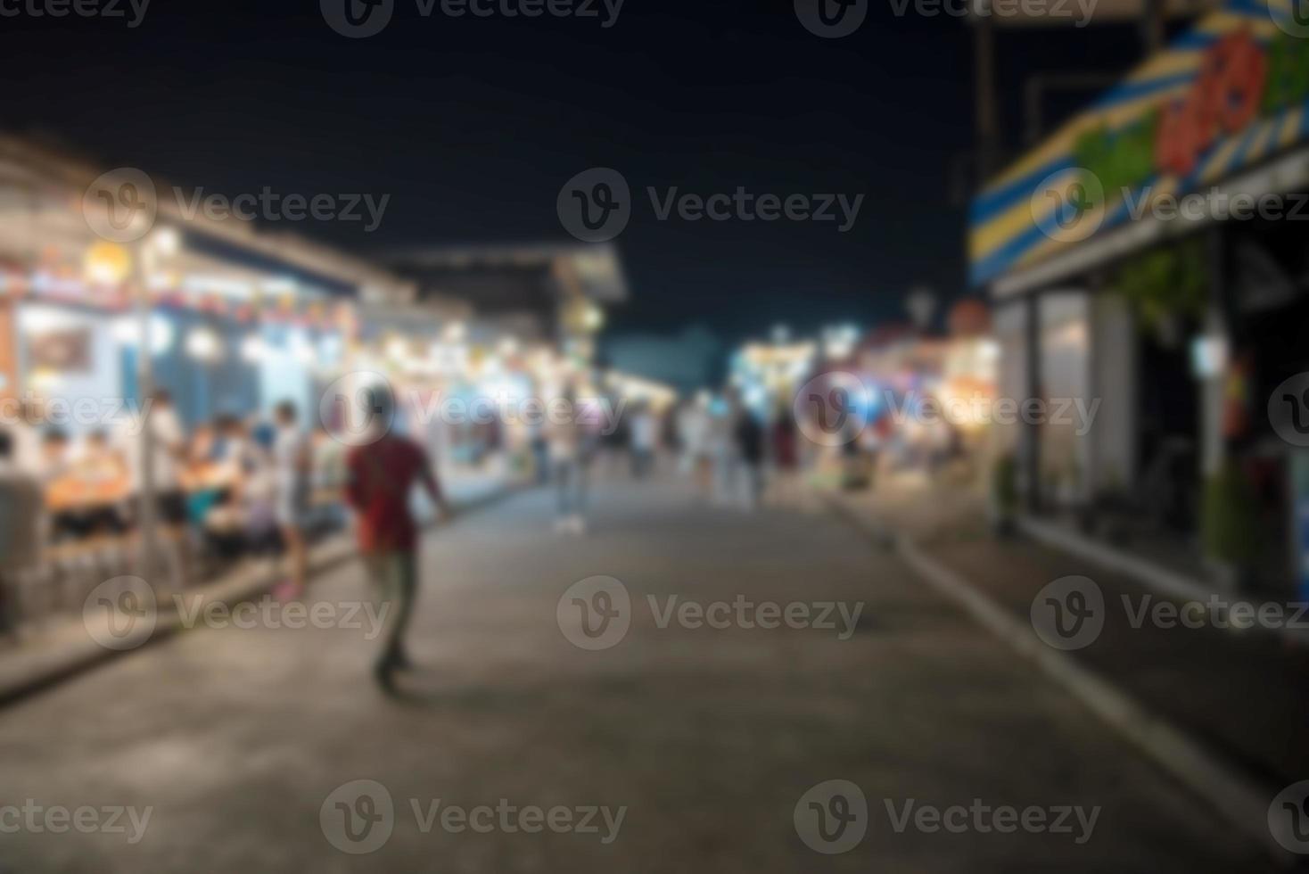 Blur person background food street festival at night market. photo